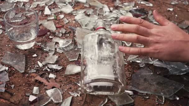 Man dies because of alcohol. Falling Hand with Bottle — Stock Footage Man dies because of alcohol. Falling Hand with Bottle Stock Video