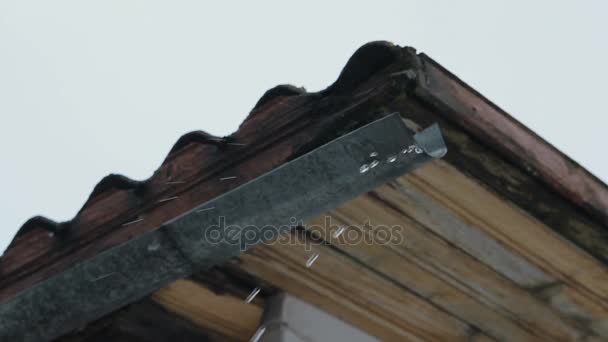 Spring Snow Melting on the Roof Old House. — Stock Video