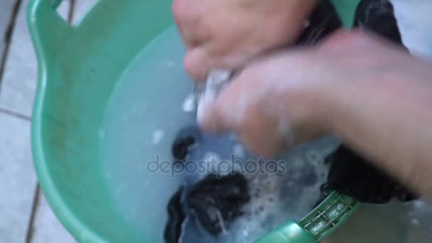 Closeup washing sock in basin by hand. mens hands, washing socks. concept of lonely men — Stock Video