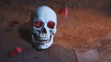 insan kafatası kırmızı kalp ile. Kalpler kafatası yavaş düşer. Sevgililer günü için kavram. AIDS