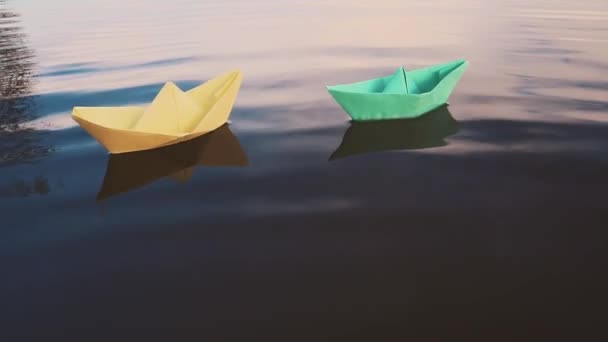 Bluei paper sailboat sailing on water. River, lake, sea. — Stock Video