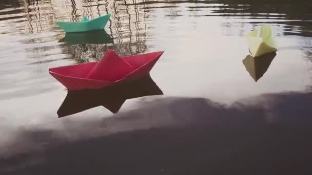 Bluei paper sailboat sailing on water. River, lake, sea. — Stock Video