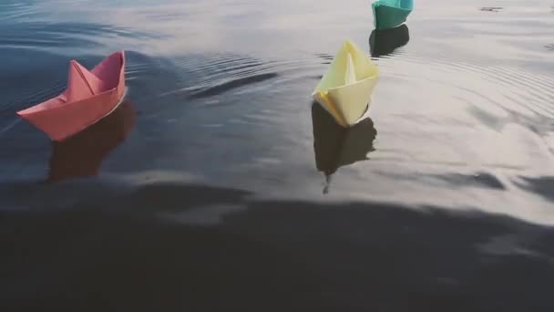 Bluei paper sailboat sailing on water. River, lake, sea. — Stock Video