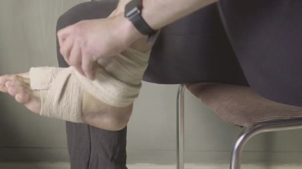 Foot resting on cushion - Sprained ankle or twisted ankle cast — Stock Video