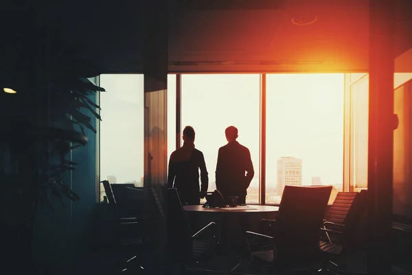 Group of business people near window