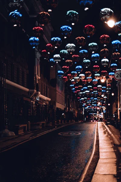 Night city road with colorful light decorations — Stock Image Night city road with colorful light decorations Royalty Free Stock Images