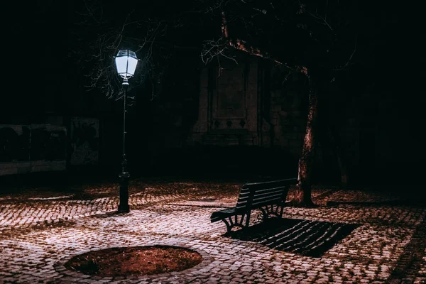 Composition with empty bench and lantern — Stock Photo, Image