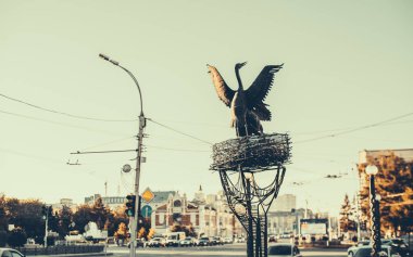Flittering metallic egret statue clipart