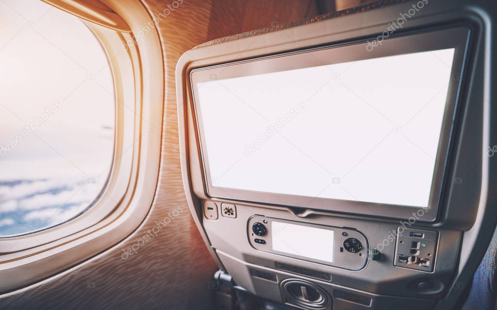 Multimedia screens templeate in seat of airplane near window