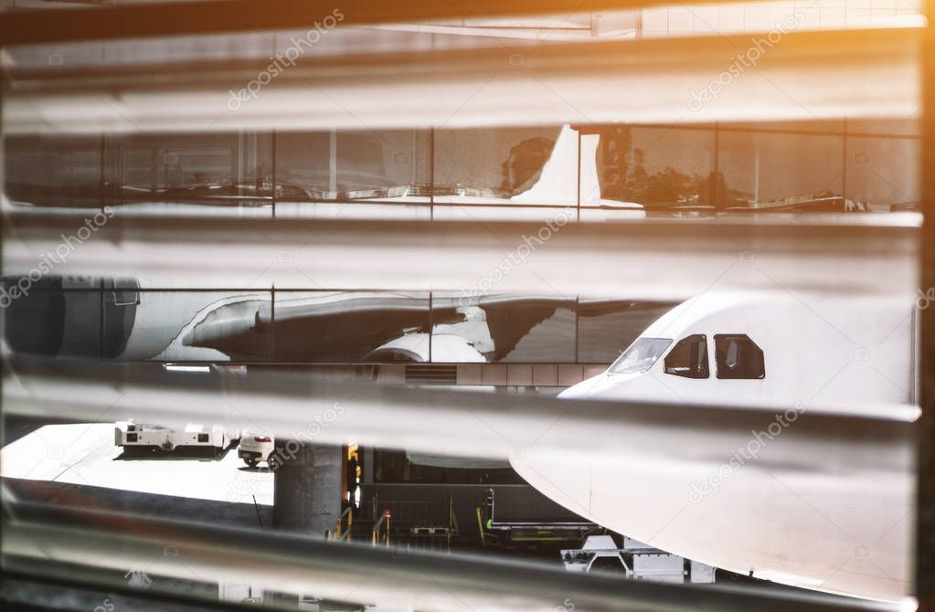 Airplane view through windows of a comtemporary airport terminal