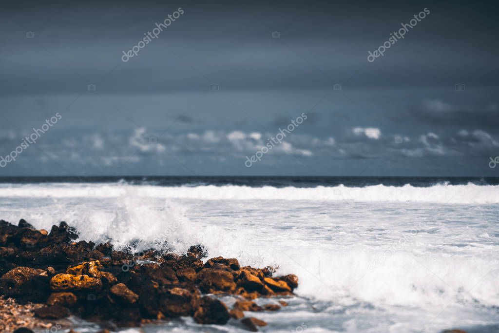 Tiltshift view of the stony seashore