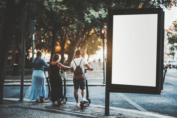 Empty banner mockup and three people