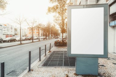 Mockup of a blank information poster in urban settings near the road with cars; an empty vertical street banner template on the sidewalk; an outdoor billboard placeholder mock-up near the highway