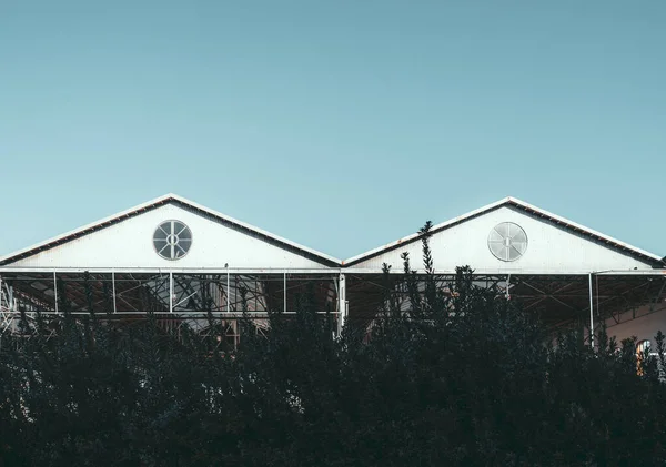 Outdoor View Two Triangle Metal Roofs Single Window Each One — Stock Photo, Image