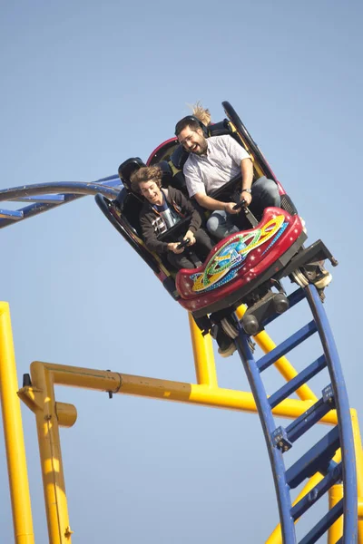 Amusement roller coaster  with people. — Stock Photo, Image