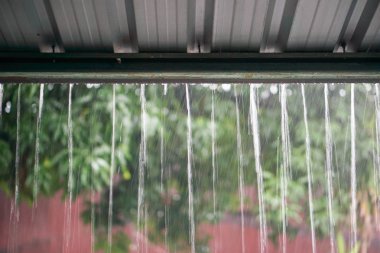rain drops fast dipping from zinc roof clipart