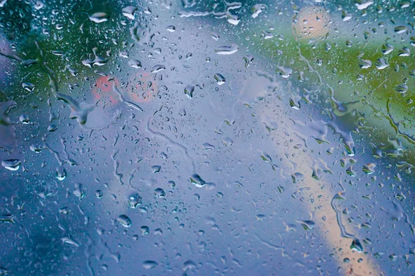 Gocce di pioggia su vetro. Contesto — Foto Stock