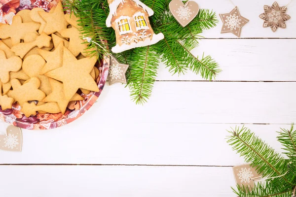 Christmas concept. Frame with a gingerbread, cones, fir-tree bra — Stock Photo, Image