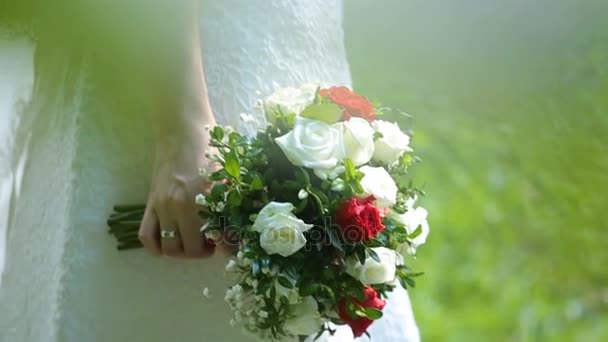 Wedding bouquet in hands of the bride — Stock Video