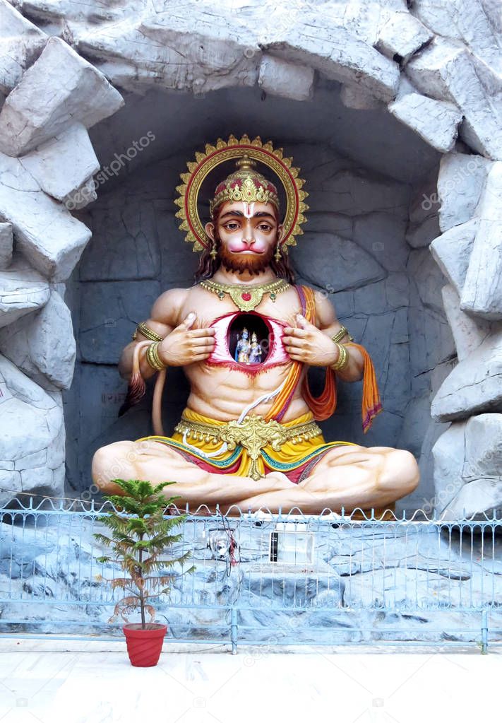 Ancient statue of Hindu god Hanuman in Rishikesh on the ghat near Parmarth Niketan Ashram. India.