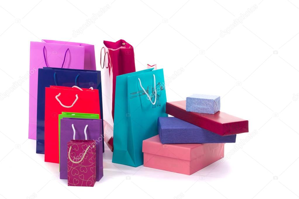 Versicolored and bright shopping packages and boxes isolated on white