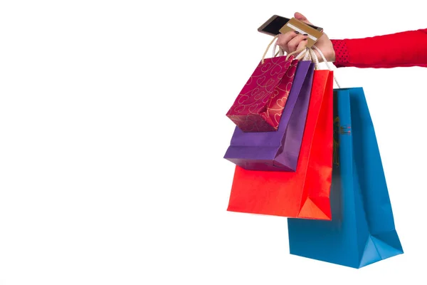 Mulher mão segurando sacos de papel de compras, pacotes, crédito bancário — Fotografia de Stock