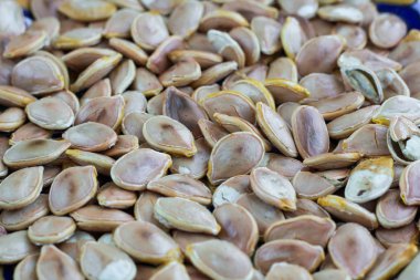 Yakın çekim yiyecek arka plan kuru kızarmış sarı Balkabağı tohumu