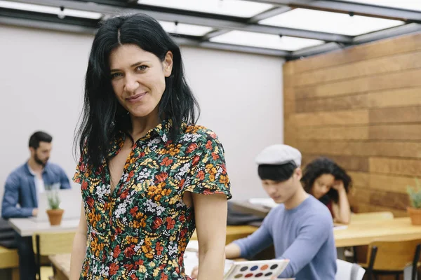 Portrait of creative young woman in office