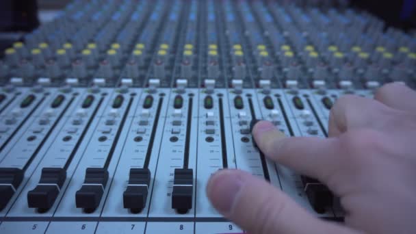 Close up of a finger raising a master audio fader — Stock Video