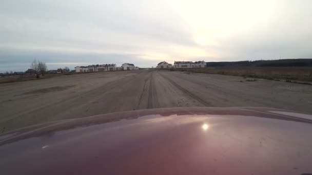 Side view of fast car moving on a evening countryside, nature, rural road, car on high speed — Stock Video