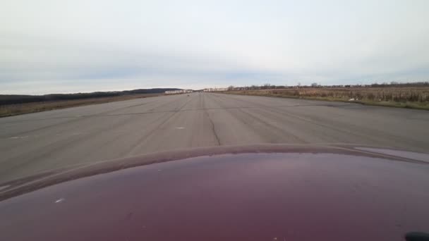 Side view of fast car moving on a evening countryside, nature, rural road, car on high speed — Stock Video