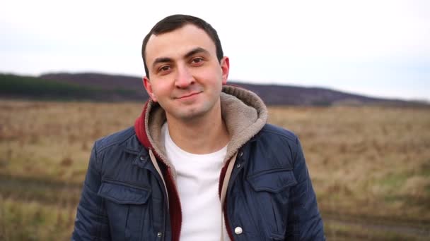 Headshot of a man wearing a jacket outdoor — Stock Video