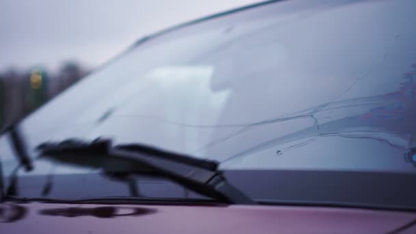 Slow motion and defocused of rain drops on windshield and car wipers are removing rains. Driving on rainy highway — Stock Video