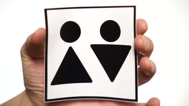 トイレ白に隔離された標識。トイレサインを示す男性の手 — ストック動画