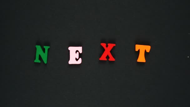 Woord vervolgens gevormd van houten veelkleurige letters. Kleurrijke woorden lus. Stop bewegingsanimatie — Stockvideo