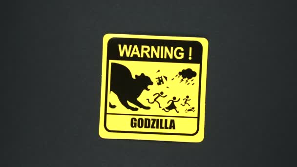 Text varovného znakového slova Godzilla