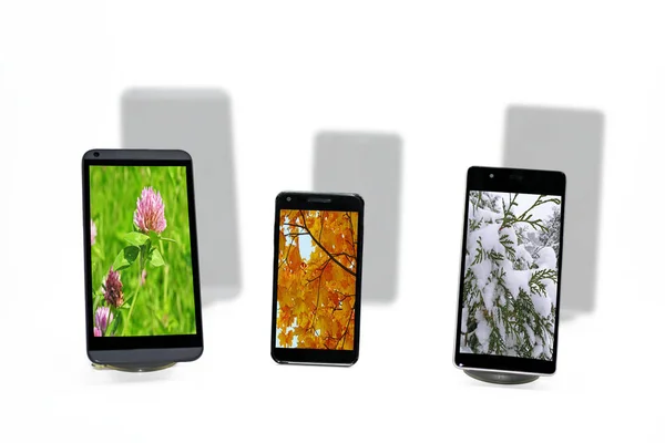 Tři smartphonů abstraktní kompozice. — Stock fotografie
