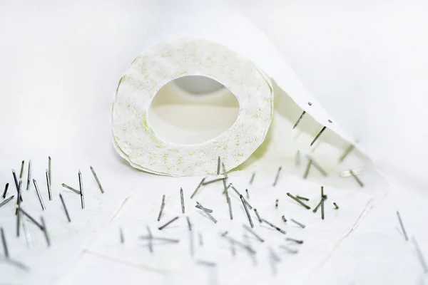 Toilet paper with nails in it. — Stock Photo, Image