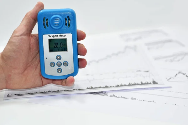 Mans hand with Oxygen meter. — Stock Photo, Image