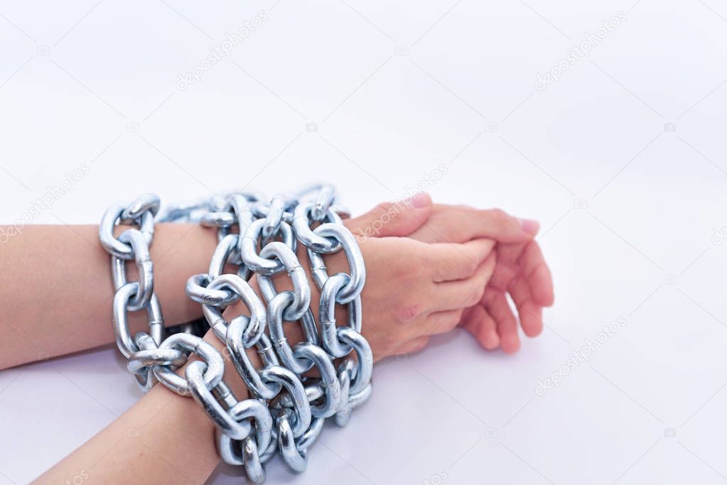 Hands and metal chain.