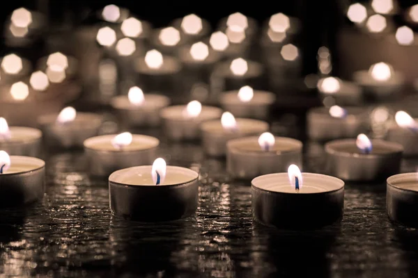 Burring candles on decorative glass. — Stock Photo, Image