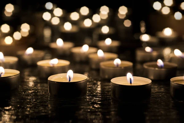 Burring candles on decorative glass. — Stock Photo, Image