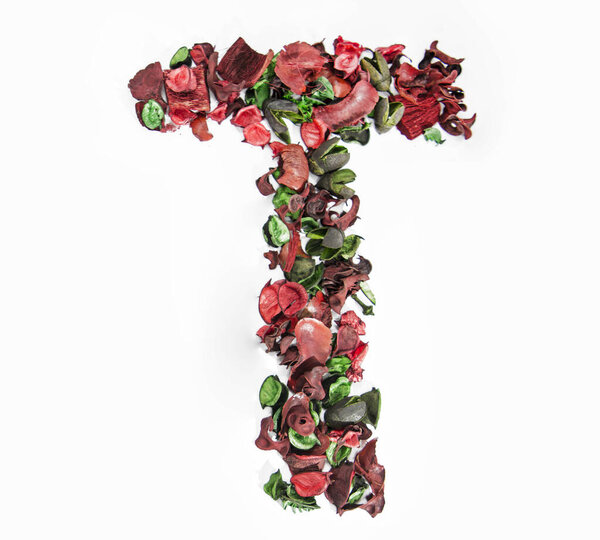 Latin alphabet letter made from dry rose flowers.