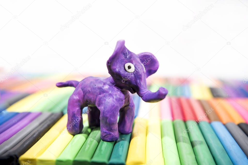 Play clay Animals. Elephant on colored background.