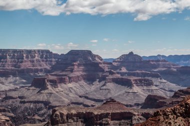 rocky crevice among the mountains of America under a blue sky covered with plants