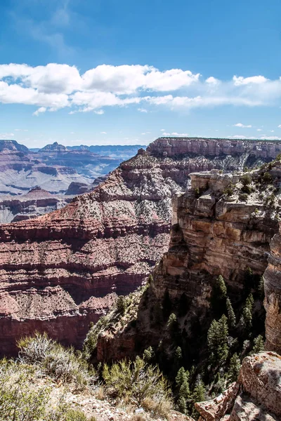 rocky crevice among the mountains of America under a blue sky covered with plants