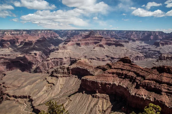 rocky crevice among the mountains of America under a blue sky covered with plants