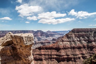 rocky crevice among the mountains of America under a blue sky covered with plants