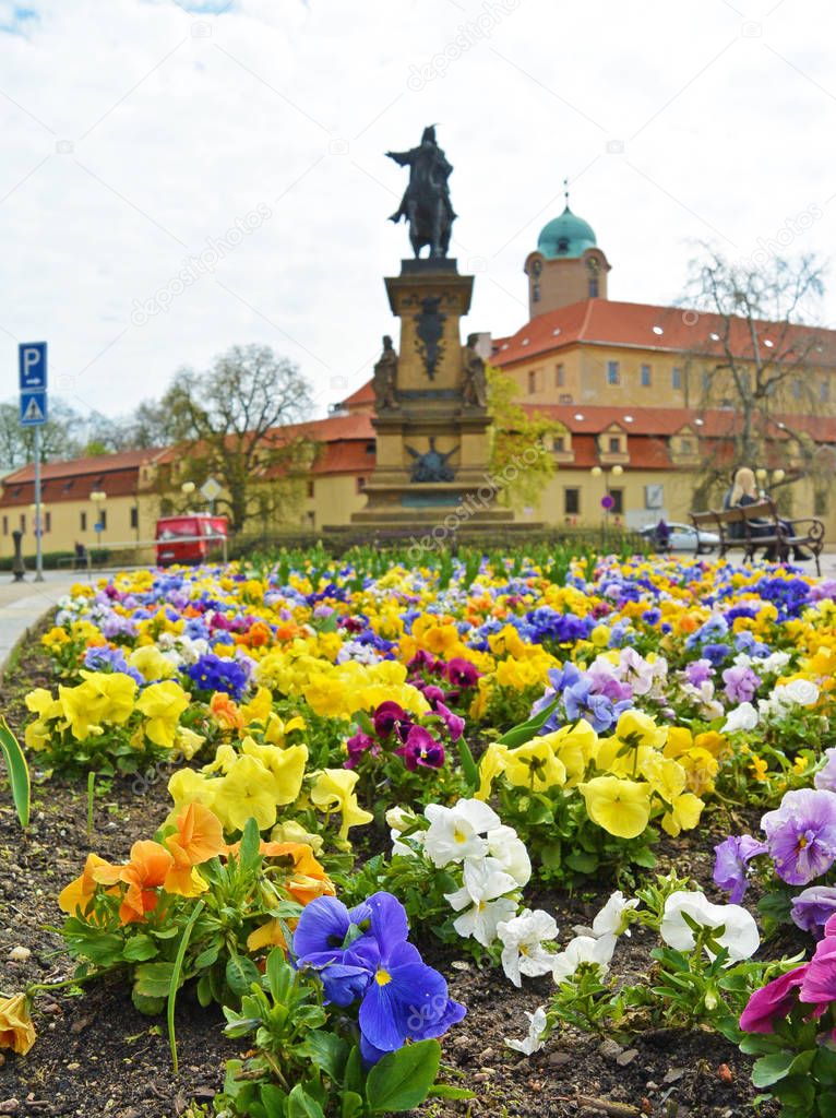 View on flowerbed on square. Czech city Podebrady