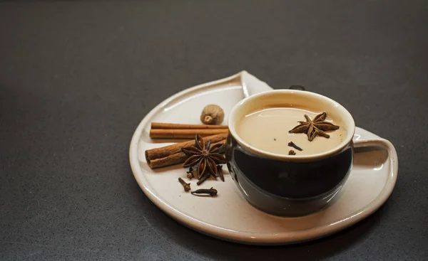 Indian tradition milk drink, masala chai tea with spices.